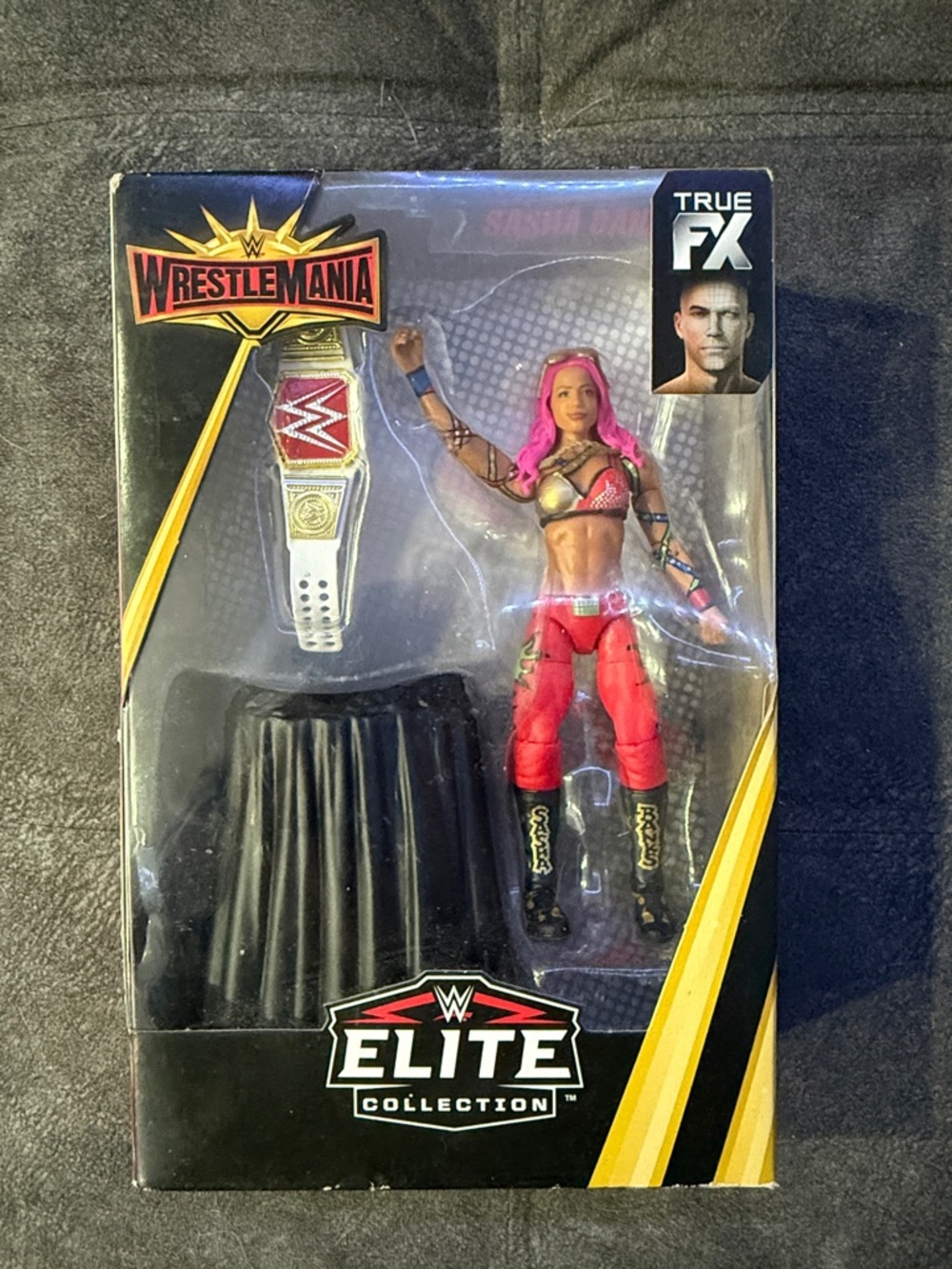 WWE Elite Collection Figure with Pink Hair & Red Ring Gear